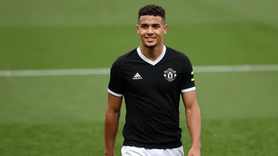 A tight waist-up shot of an anonymous, 28-year-old, Brazilian, Newcastle United player, wearing a black jersey with a...
